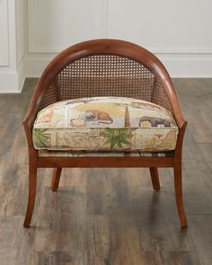 a wooden chair with an upholstered back and seat cushion on top of it