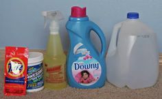 several cleaning products are sitting on the floor next to each other, including detergent and dishwasher