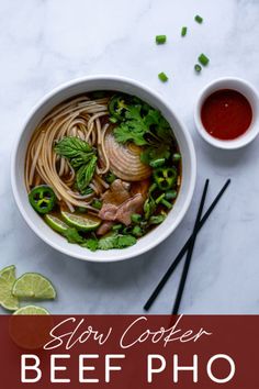 slow cooker beef pho noodle soup in a bowl with chopsticks