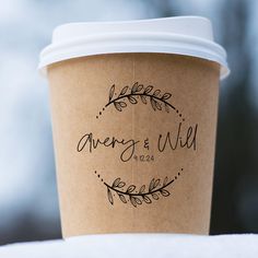 a cup of coffee with the words avery and wild written on it's side