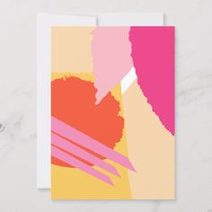 a card with pink, yellow and orange paint strokes on white paper in front of a marble background