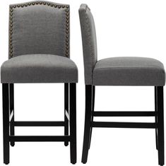 pair of grey upholstered bar stools with studded arms and backrests