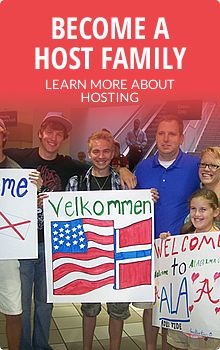 a group of people holding signs and posing for a photo