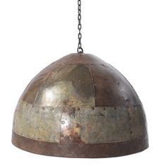 an old metal dome light hanging from a chain