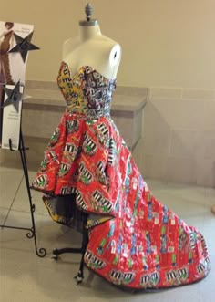 a mannequin is dressed up in a colorful dress