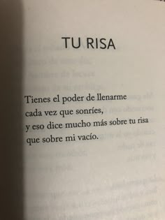 an open book with the words tu risa written in spanish