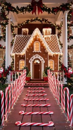 a gingerbread house decorated for christmas with candy canes