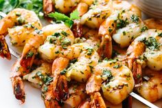 grilled shrimp on skewers with garnish and parsley