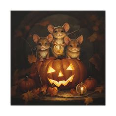 three mice sitting on top of a pumpkin with a carved jack - o'- lantern