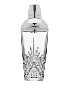 a glass jar with a metal lid and an intricate design on the front, set against a white background