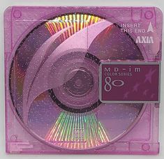 the cd is in its plastic case with pink and purple designs on it's side