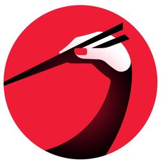 a black and white bird with chopsticks in it's beak on a red circle