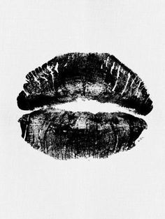 a black and white photo of two lips