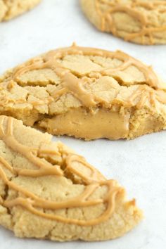 cookies with peanut butter frosting on a baking sheet