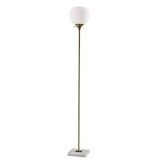 a floor lamp with a white shade on it