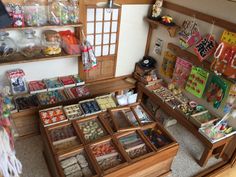 an overhead view of a store with many items in the display case and on shelves