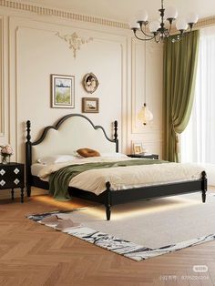 a bed room with a neatly made bed and a chandelier