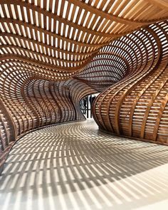 the inside of a wooden structure that is made out of wood and has wavy lines on it