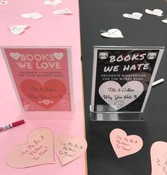 valentine's day books we love display with pink and white paper hearts on it