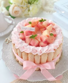 there is a cake with fruit on top