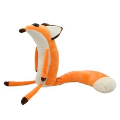 an orange stuffed animal laying on its side with it's tail curled up and eyes closed