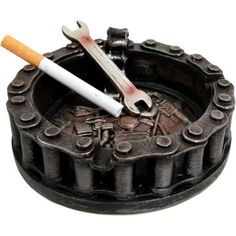 This Motorcycle Ashtray with Wrench and Bike Design is made of polyresin, hand painted and polished individually. Williston Forge | Williston Forge Grosse Chain Ashtray Figurine 2.0 H x 5.0 W x 5.0 D in / grayResin in Black | 2" H X 5" W X 5" D | Wayfair | Home Decor Car Parts Decor, Cool Welding Projects, Metal Welding Art, Scrap Recycling, Car Part Furniture, Welding Art Projects, Diy Welding, Automotive Decor, Metal Welding