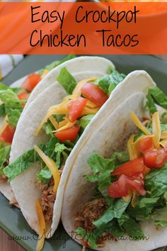 easy crockpot chicken tacos with lettuce and tomatoes