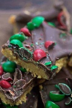 a close up view of a piece of cake with green and red decorations on it