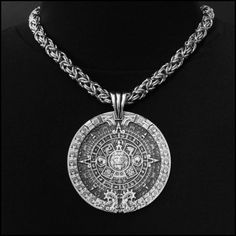 "This piece features my huge 3\" (76mm) Aztec Calendar Stone design pendant. It includes a thick 8mm polished round chainmaille necklace. It will catch every eye within 50 feet and be the source of many conversations. The look and feel of our necklace upon the first touch will speak to you immediately of hand-crafted quality. It makes a stunning accessory - appropriate for all ages, men or women - all will love it. It includes a black velvet jewelry pouch, my signed certificate of authenticity, Engraved Metal Round Pendant Chain Necklace, Aztec Jewelry, Chainmaille Necklace, Aztec Calendar, Velvet Jewelry, Medallion Design, Stone Design, Top Gifts, Star Pendant