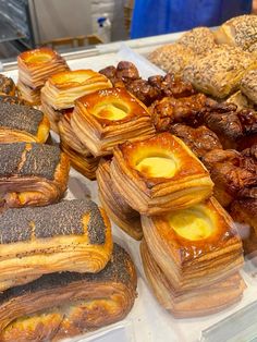 many different types of pastries are on display