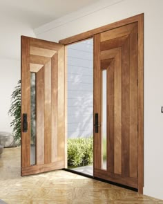 an open wooden door in a white room