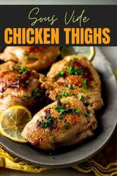 chicken thighs on a plate with lemons and parsley