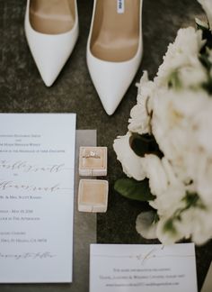 a wedding suite with white flowers and shoes