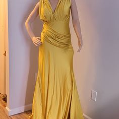 This Dress Is Not Brand New But Was Worn Once. It's In A Very Good Condition , It Stretches Gold A-line Fitted Evening Dress, Gold Fitted A-line Evening Dress, Formal Ruched Evening Dress, Yellow Fitted A-line Evening Dress, Fitted A-line Yellow Evening Dress, Fitted Yellow A-line Evening Dress, Ruched A-line Evening Dress For Party, Elegant Ruched Yellow Maxi Dress, Long Ruched Evening Dress For Formal Occasions