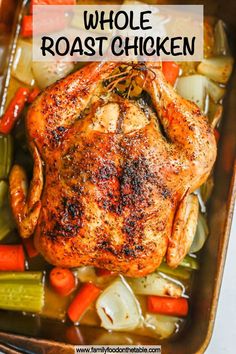 whole roast chicken with carrots and celery in a casserole dish