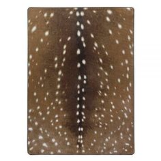 a deer skin rug with white spots on it