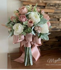 a bridal bouquet with pink and white flowers