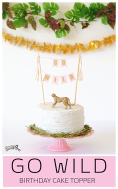 a birthday cake topper with a cheetah on it and the words go wild