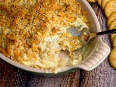 a casserole dish filled with cheese and crackers