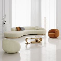 a modern living room with white walls and flooring, including an oval shaped couch