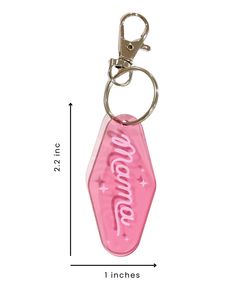 a pink keychain with the words welcome on it