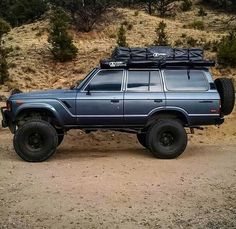 an off road vehicle is parked in the dirt