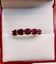 Absolutely Stunning Vintage 14k Yellow Gold Natural Rubies  band Ring 100%  Natural Rubies  Beautiful genuine Ruby 6x4 mm each 5 Rubies                                       2.25 CTW Clarity:                                              VS2 Total ring weight:                        4.1 GR 14K Yellow Gold Ring sizing available Free of Charge For more information regarding this item feel free to reach me so I can accommodate your needs.  Thank you Oval 14k Gold Eternity Band, Classic Oval Eternity Band With Vs Clarity, Classic Oval Stackable Eternity Band, Elegant Oval Ruby Stackable Ring, Oval Stackable Ruby Ring In Yellow Gold, Formal Oval Gemstone Stackable Rings, Fine Jewelry Stackable Oval Ruby Ring, Oval Gemstone Stackable Rings For Formal Occasions, Fine Jewelry Oval Stackable Rings With Prong Setting