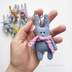 a hand holding a tiny crocheted bunny keychain