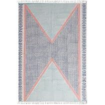 a blue and pink rug with fringes on the bottom, in an x pattern