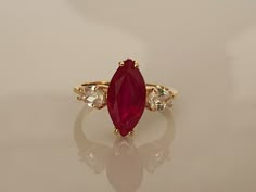 Express Shipping 3-5 Days with UPS PRODUCT DESCRIPTION Marquise Engagement Ring, Marquise cut Ruby Ring, Ruby Rings for Women, Red Ruby Ring, Engagement Ring, Promise Ring This gorgeous 14K Gold Filled Over 925 sterling silver Lab. Ruby ring The stones are set in a solid .14K Gold Filled Over 925 sterling silver size 4-16 USA. Please note, ring process 5-8 business days. All of our items are shipped in a complimentary gift box. Main Stone: Lab. Ruby Size: 13 x 7 mm Cut: Marquise Cut Metal:14K Go Red Ruby Ring Vintage, Luxury Marquise Cut Ruby Ring, Big Ruby Engagement Ring, Engagement Rings With Rubies, Gold Ring Red Stone, Unique Ruby Engagement Rings, Red Stone Ring Women, Ruby Stone Ring, Ruby Ring Designs