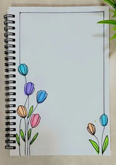 an open notebook with flowers drawn on it