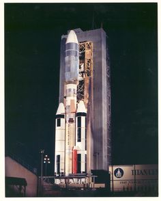 an old photo of a saturn rocket on display