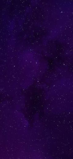 the night sky is filled with stars and purple hues as well as dark clouds