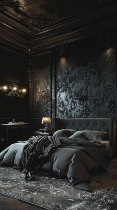 a large bed sitting next to a night stand in a room with black walls and flooring